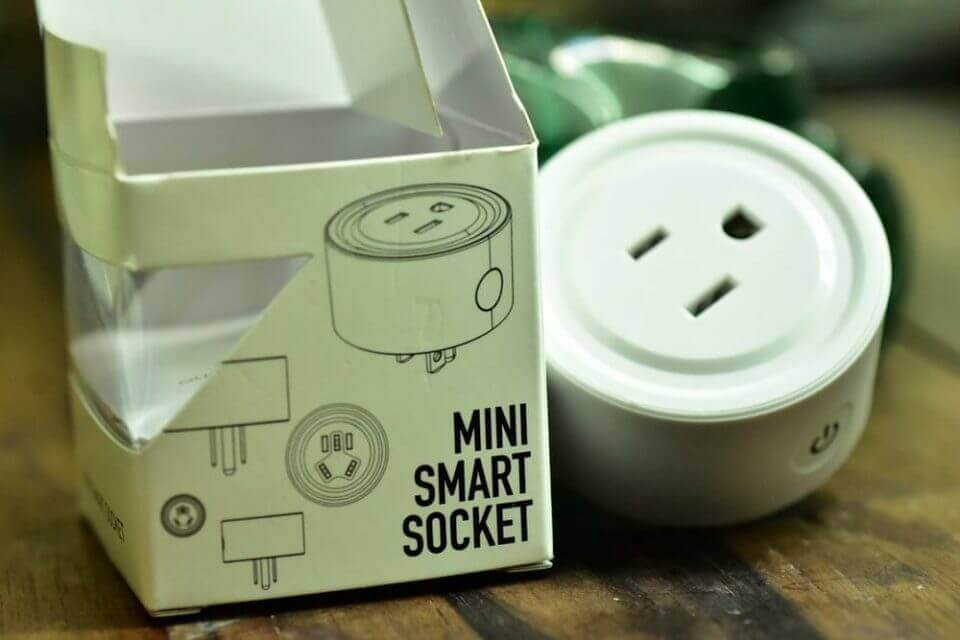 A mini smart socket next to a box, beginning smart home automation with Alexa in the Philippines.