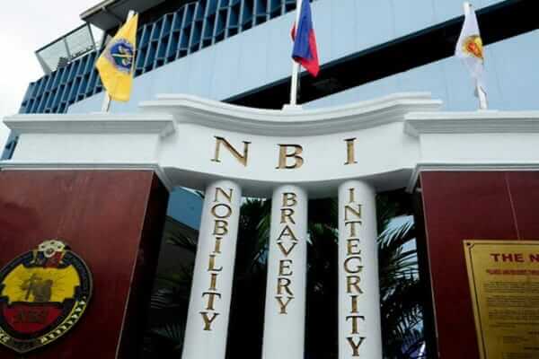 NBI building with flags and an NBI sign.