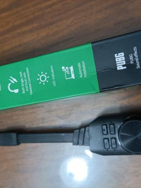 A green box with a virtual 7.1 channel USB sound card next to it.
