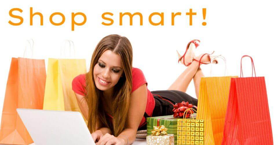 A woman enjoying the best online deals of the year with shopping bags and a laptop during the 11.11 sale event.