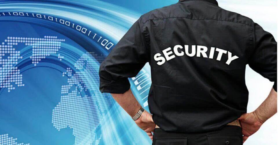 A man wearing a black security shirt.