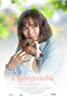A woman with shoulder-length brown hair gently holds a small brown and white dog close to her face. The soft, blurred green background evokes a serene outdoor setting reminiscent of scenes from popular movies. The text "Unforgettable" is elegantly scripted at the bottom.