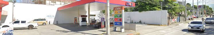 A gas station in the Philippines with electric vehicle (EV) charging stations.