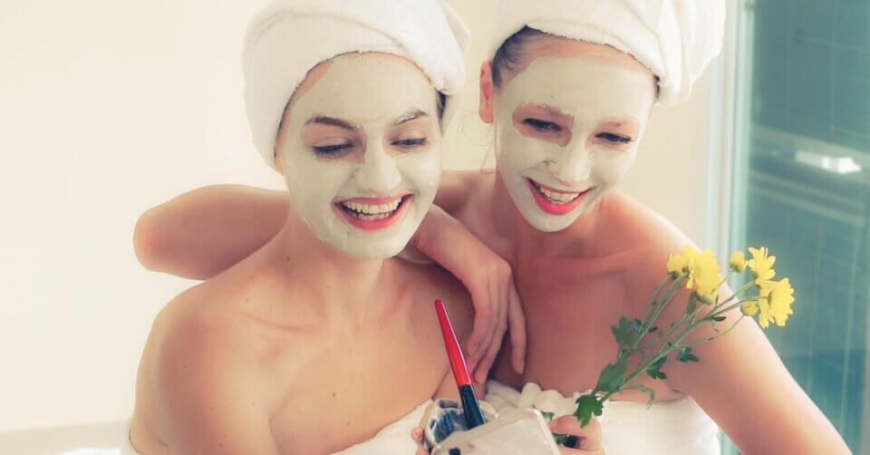 Two women wearing facial masks in one of Manila's best dermatology clinics.