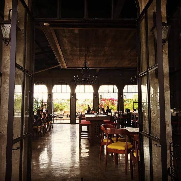 The #balaydako restaurant exudes a welcoming ambiance with its tables and chairs at the entrance.