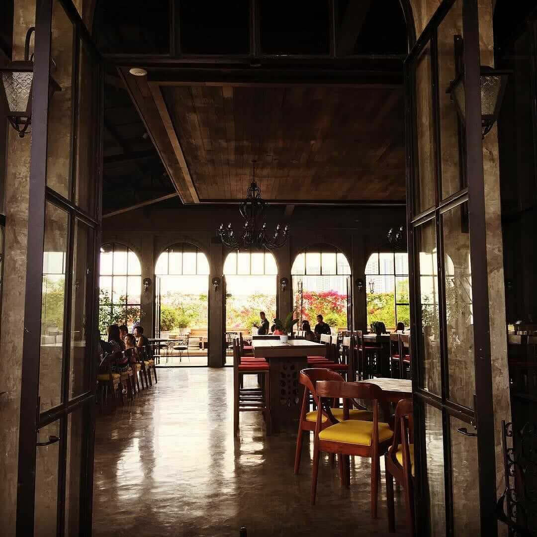 The #balaydako restaurant exudes a welcoming ambiance with its tables and chairs at the entrance.