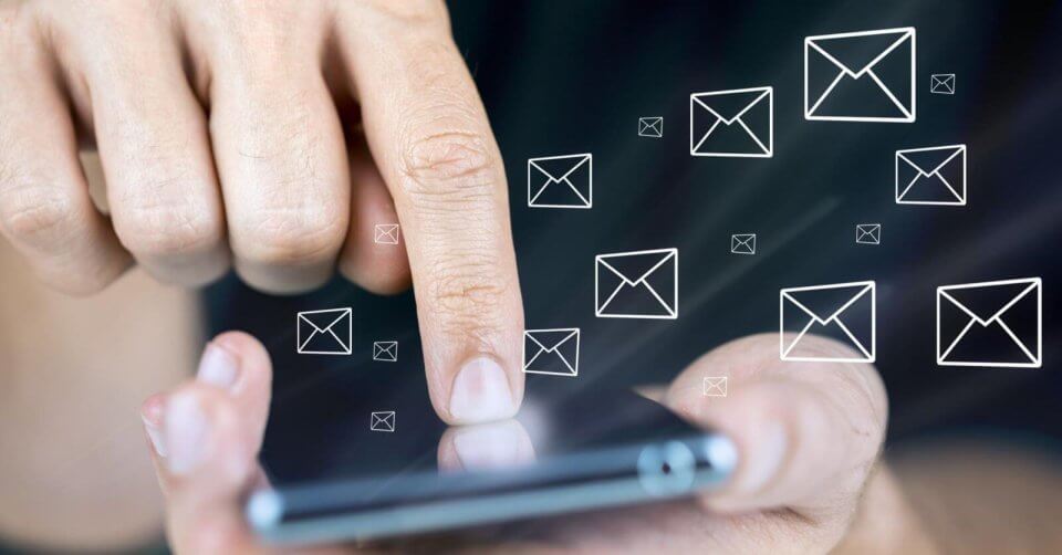 a hand is holding a phone displaying sms icons, highlighting the convenience of sms api services available in the philippines.