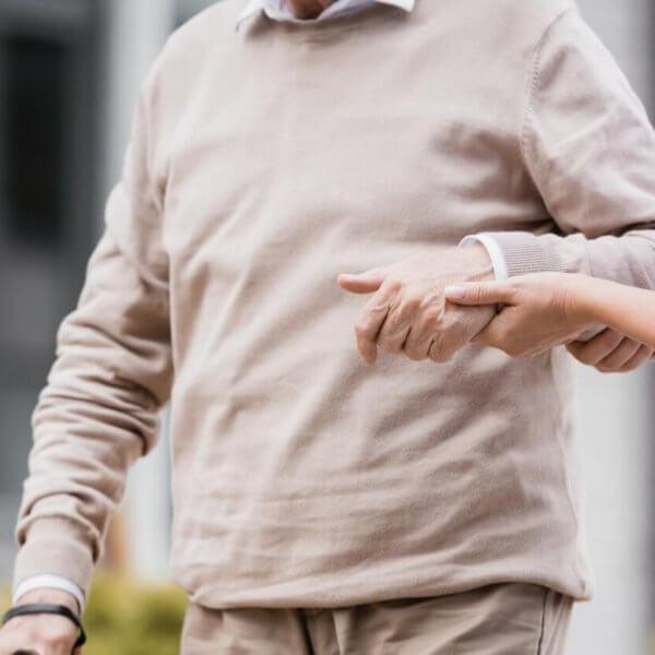 A doctor pointing at a man's hand in the Philippines.