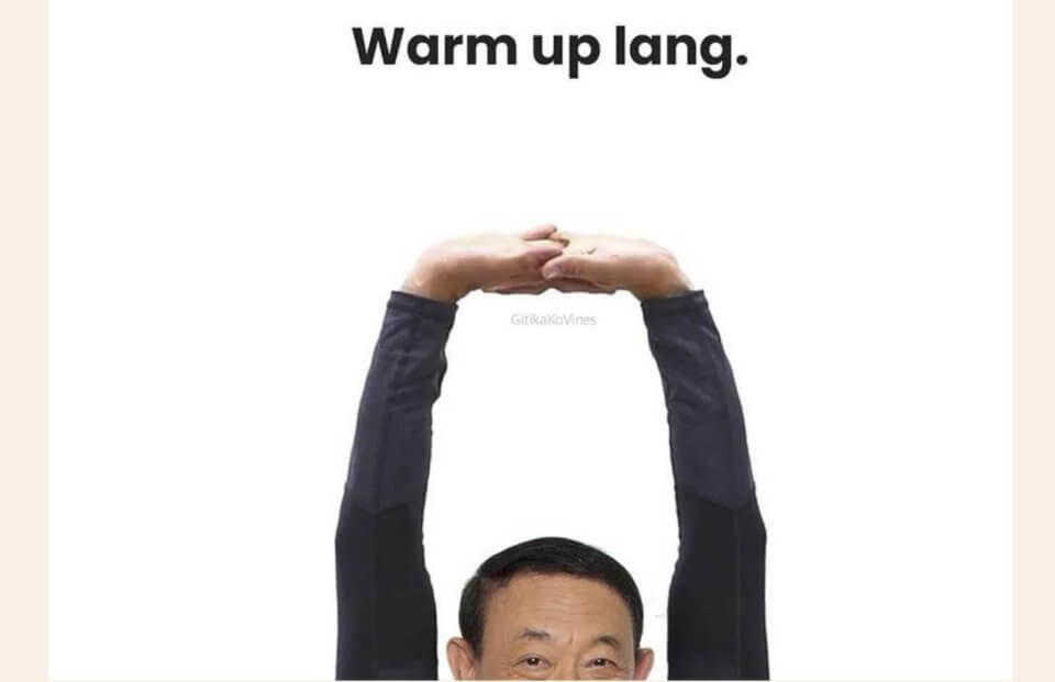 A person with short dark hair stretches their arms above their head, reaching upwards. They wear a long-sleeved dark top. Above them, text reads "Warm up lang." The minimalist white background hints at the anticipation felt as Jose Marie Chan memes reemerge with the approach of Christmas.