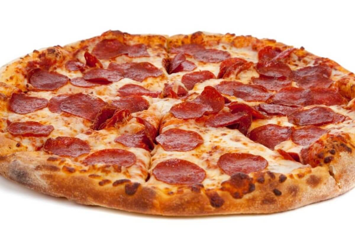 A whole pepperoni pizza from Angel's Pizza in the Philippines sits on a white background. It boasts a golden-brown, crispy crust, topped with melted cheese and evenly distributed pepperoni slices. The cheese is slightly browned in spots, indicating it's freshly baked to perfection.