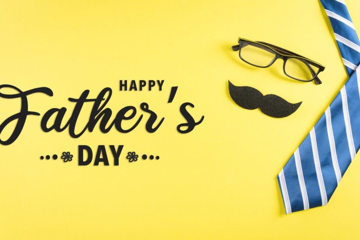 A bright yellow background showcases a pair of black glasses, a black mustache cutout, and a blue and white striped necktie. The bold, black text reads "Happy Father's Day" with small decorative floral elements on either side. Perfect for heartfelt messages or gift ideas to make the day special.
