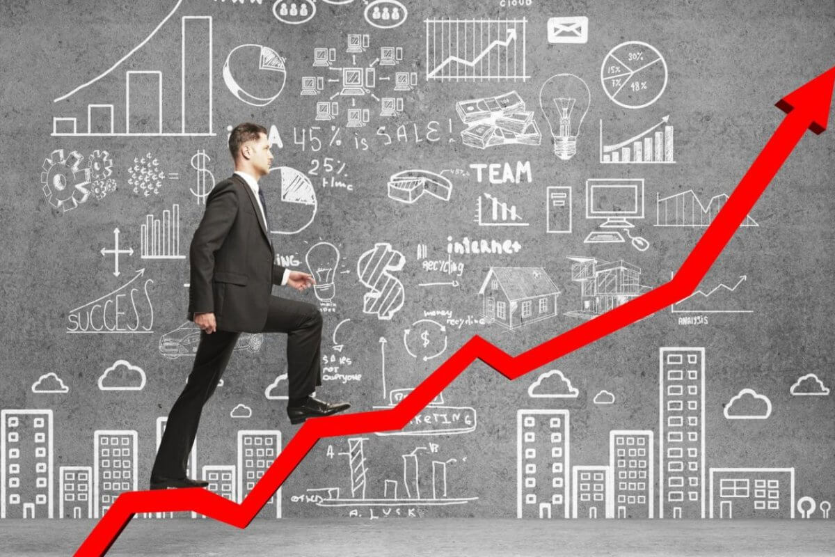 A man in a suit strides up a red arrow, surrounded by business doodles and city buildings, symbolizing the growth of Negosyo Centers in the Philippines.