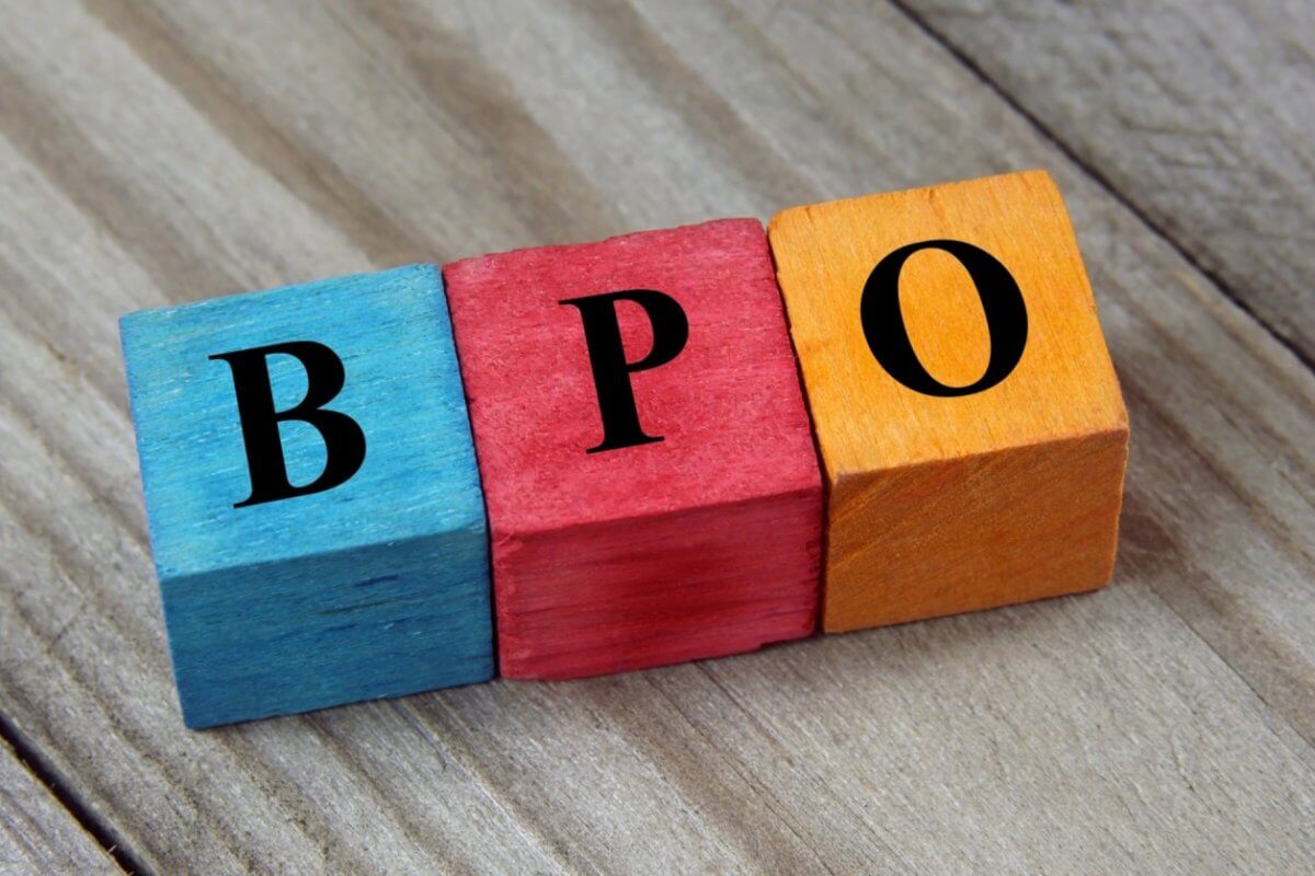 Colorful wooden blocks on a wood surface spell BPO in bold black letters, symbolizing the dynamic career growth opportunities offered by BPO companies in Makati City.