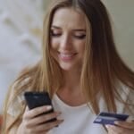 Filipino shopper comparing Buy Now, Pay Later and card payment options on a smartphone while checking out an online purchase