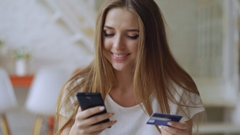 Filipino shopper comparing Buy Now, Pay Later and card payment options on a smartphone while checking out an online purchase