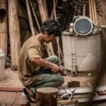 Appliance repair technician servicing a unit — the exact scenario an extended warranty in the Philippines is meant to cover