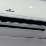 Wall-mounted split-type air conditioner unit in a Philippine home, the kind of appliance covered in this repair-vs-replace cost breakdown