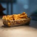 Crispy golden French fries, a classic air fryer dish, illustrating Sulit.ph's Philippine air fryer worth-it and electricity cost guide