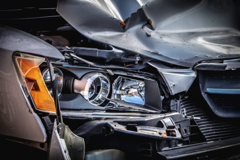 Damaged car with a crushed front hood and broken headlight — the kind of own-vehicle collision damage CTPL does not cover in the Philippines, which is why comprehensive car insurance exists