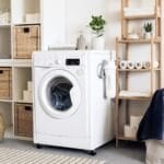 Close-up of a white front-loading clothes dryer drum door, the type of vented or condenser tumble dryer covered in this Philippine buying guide