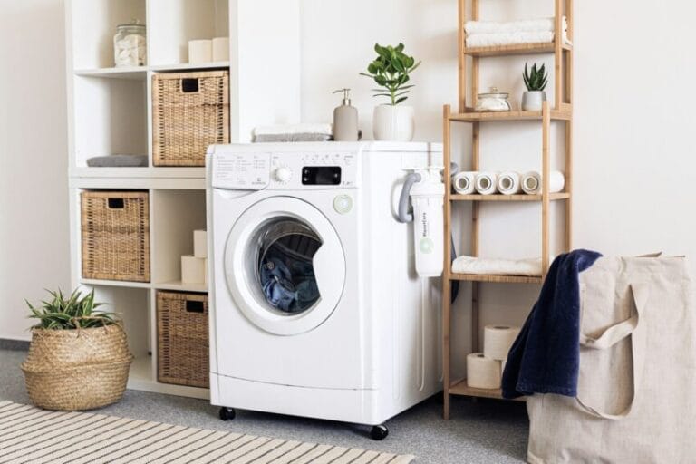 Close-up of a white front-loading clothes dryer drum door, the type of vented or condenser tumble dryer covered in this Philippine buying guide