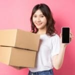 How to Win a Refund Dispute on Shopee, Lazada & TikTok Shop in the Philippines (2026 Step-by-Step Guide) Filipino online shopper holding a delivered package box while checking a return/refund request on her phone after receiving a defective item from Shopee, Lazada, or TikTok Shop