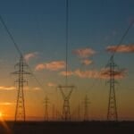 Electrical transmission towers carrying power lines on the Luzon grid, whose thinning reserves trigger the NGCP red alerts behind Philippine rotating brownouts