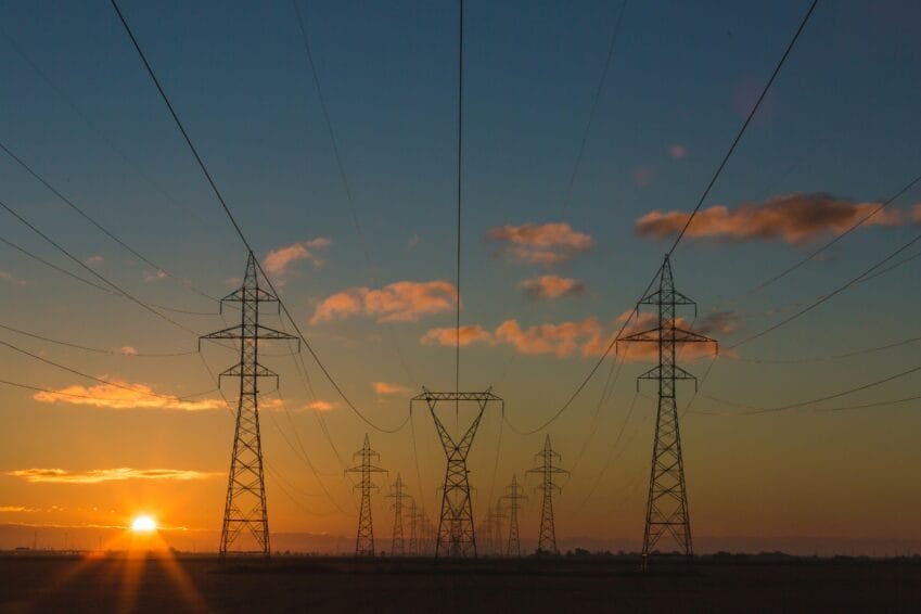 Electrical transmission towers carrying power lines on the Luzon grid, whose thinning reserves trigger the NGCP red alerts behind Philippine rotating brownouts