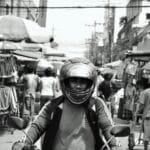 Is 0% or Low-Down Motorcycle Financing Worth It in the Philippines? (2026 Guide) Commuter riding a motorcycle through Metro Manila traffic, the kind of everyday motorcycle purchase decided with financing in the Philippines