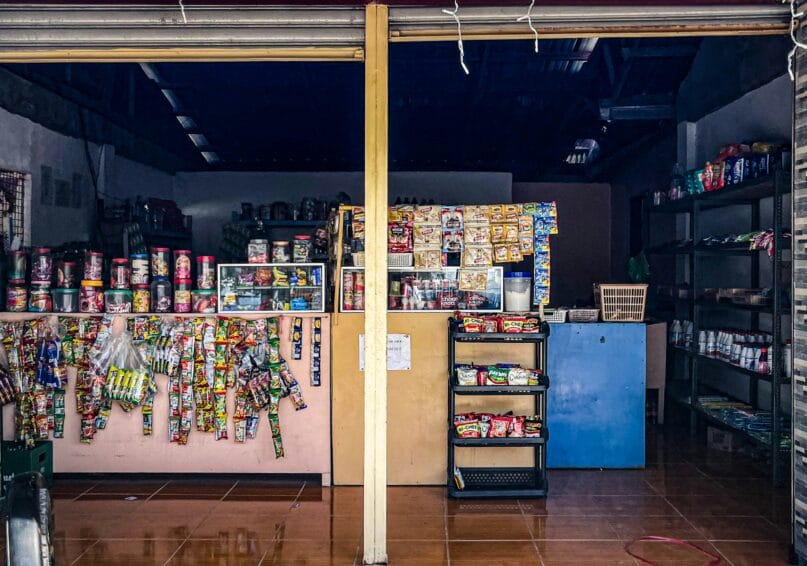 Interior of a small Philippine retail store, the kind of shop where a handwritten No Return No Exchange sign is commonly posted near the counter