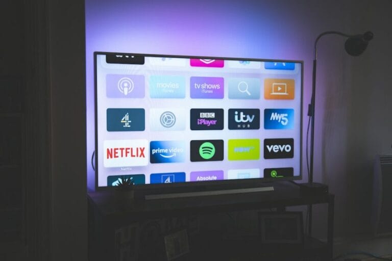 TV screen showing a grid of streaming service app icons in a dim living room, representing the multiple paid subscriptions like Netflix, Disney+, and Max that Filipino households juggle