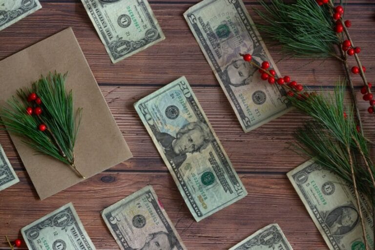 Counting cash bills while budgeting for December expenses, representing the decision Filipino workers face on whether to save, pay off debt, or spend their 13th month pay