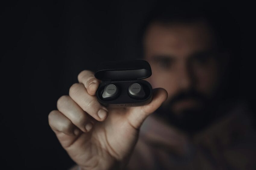 Close-up of a hand holding wireless ANC (active noise-cancelling) earbuds, the Jabra Elite 85t, the product type covered in this Philippine buying guide