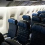 Rows of empty economy airplane seats, illustrating the paid seat-selection decision on AirAsia and Cebu Pacific budget flights in the Philippines
