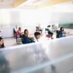 Open coworking space with shared desks and laptops where freelancers and remote workers in the Philippines can rent a seat