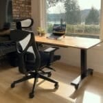A solid wood standing desk paired with a mesh-back ergonomic office chair in a home office setup, illustrating the chair-vs-standing-desk buying decision for WFH in the Philippines