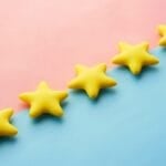 Row of five gold star rating icons, representing an inflated 5-star product review score on Philippine online shopping apps like Shopee, Lazada, and TikTok Shop
