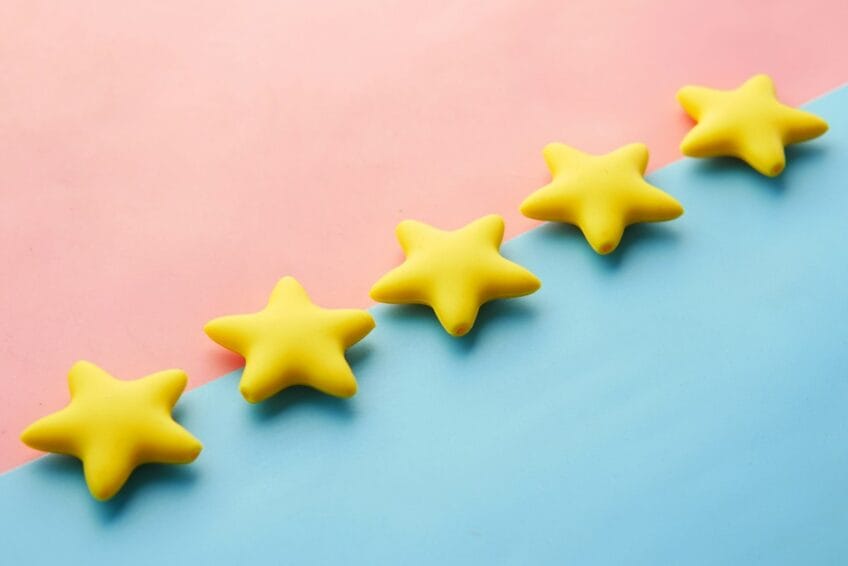 Row of five gold star rating icons, representing an inflated 5-star product review score on Philippine online shopping apps like Shopee, Lazada, and TikTok Shop