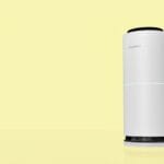 White cylindrical HEPA air purifier running in a home, the kind of unit covered in this guide to whether an air purifier is worth buying in the Philippines