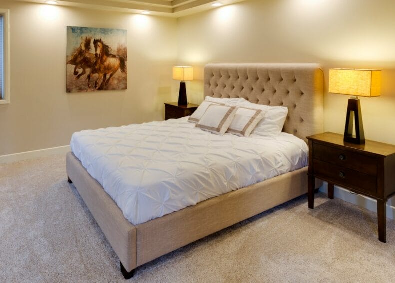 A bare foam mattress on a bed frame, illustrating the mattress-in-a-box versus traditional mattress comparison for Filipino buyers