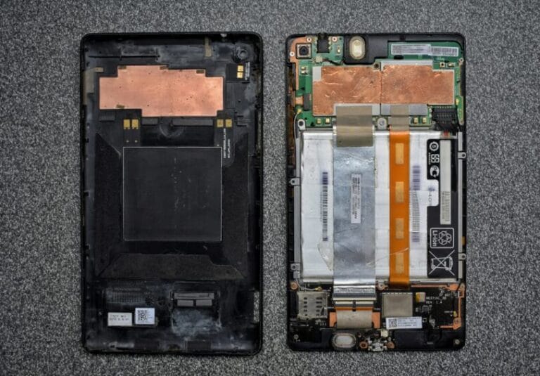 An older smartphone showing visible battery wear and a worn charging port — the kind of aging device this guide covers deciding whether to trade in or sell yourself in the Philippines