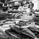 Inside a Philippine palengke (wet market) in Balintawak, Quezon City, with vendor stalls selling fresh produce