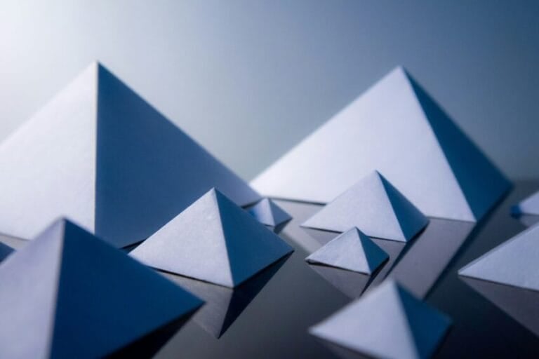Abstract stacked pyramid shapes symbolizing a pyramid scheme's recruitment structure, illustrating the Philippines MLM vs. pyramid scheme guide
