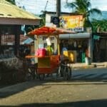 Is Buying a Food Cart or Kiosk Franchise Worth It in the Philippines? (2026 Franchise Fee, EO 169 & Scam-Check Guide) A small street food cart on a sidewalk in Cebu City, Philippines, the kind of setup franchisors scale into branded kiosk franchises
