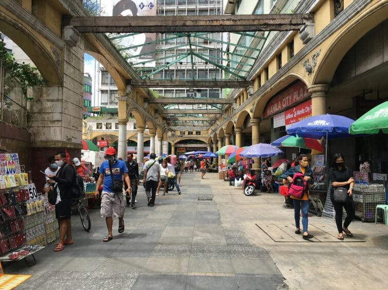 Crowded vendor stalls along a street market in Quiapo, Manila — the kind of tiangge setting this Philippine Christmas bazaar shopping guide covers